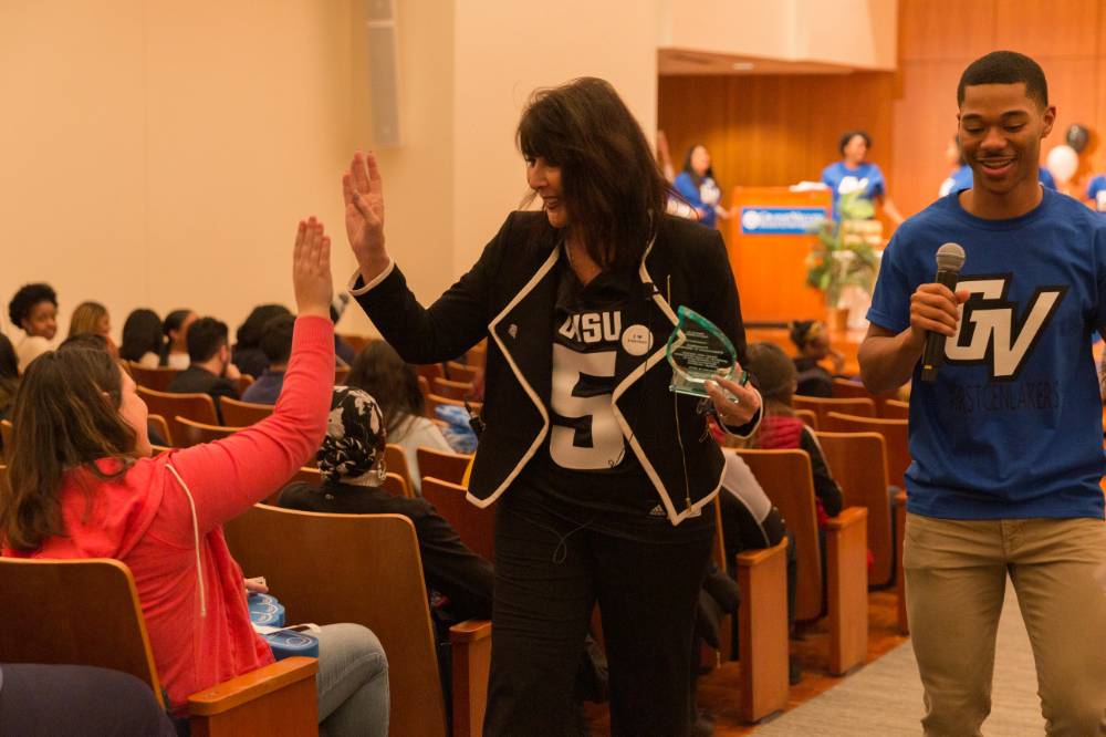 Image of Dr. Mantella high-fiving audience member
